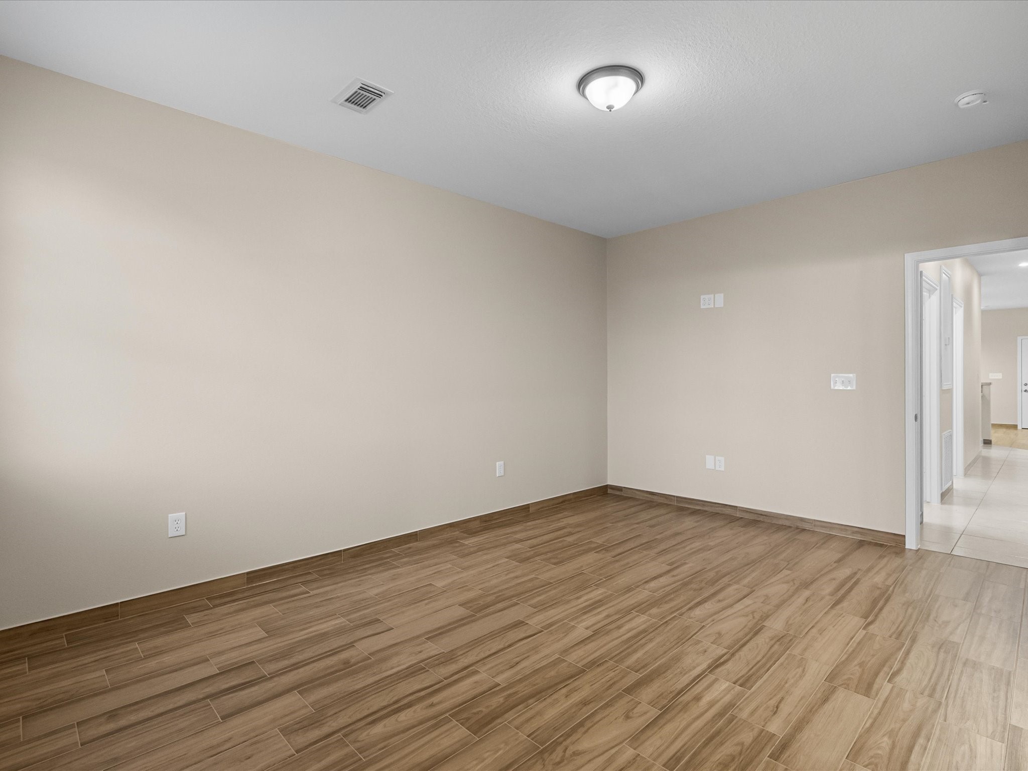 533 12th Street San Leon, TX 77539 - Photo 20 of 29 a view of an empty room with wooden floor