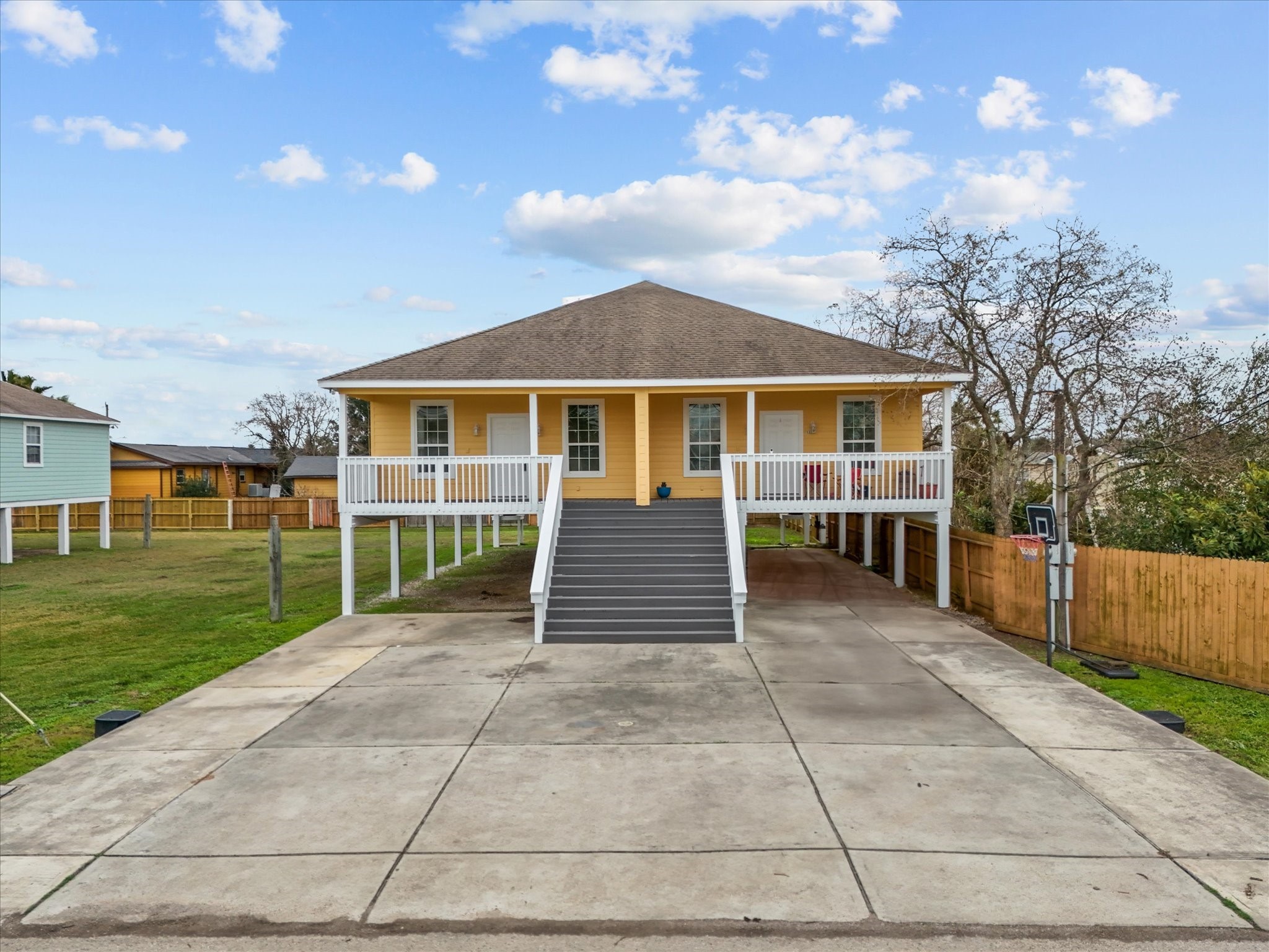 533 12th Street San Leon, TX 77539 - Photo 3 of 29 a front view of a house with a garden