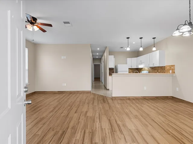 a view of kitchen with wooden floor