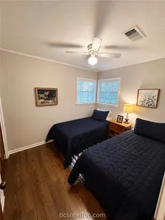 a bedroom with bed and a window
