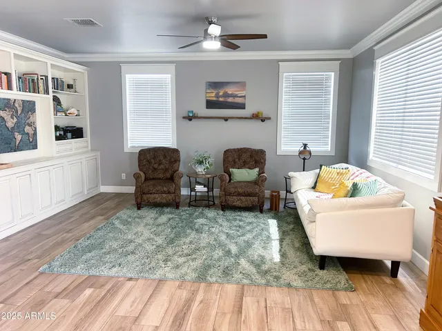 a view of an empty room with cabinet and a window