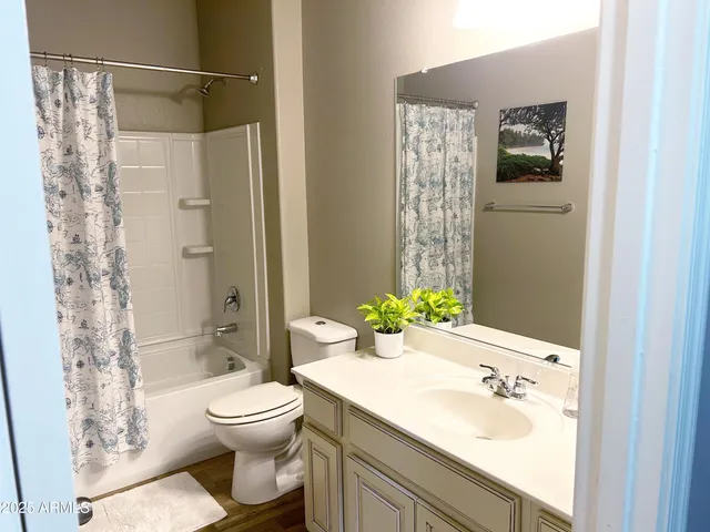 a bedroom with a bed and a mirror