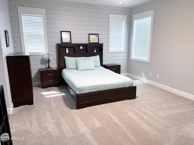 a bathroom with a double vanity sink and mirror