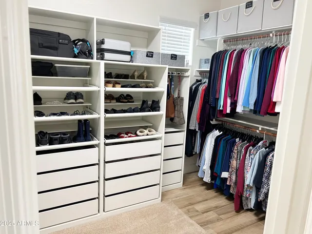 a backyard of a house with barbeque oven table and chairs