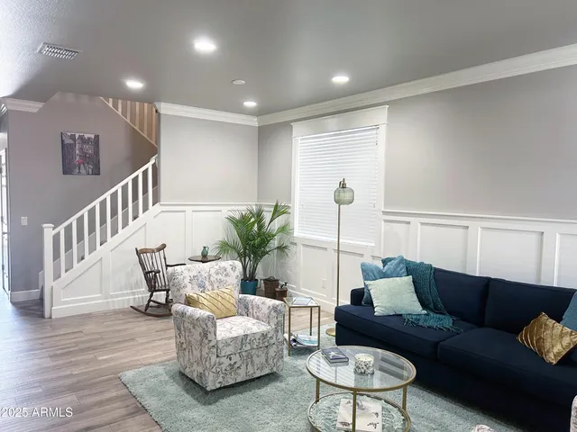 a living room with furniture and a table