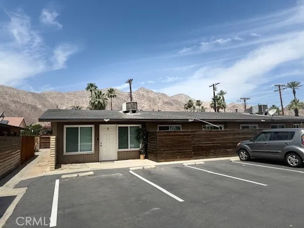 a view of a car parked in front of a house
