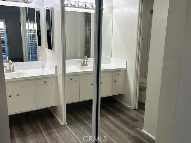 a bathroom with a double vanity sink and mirror