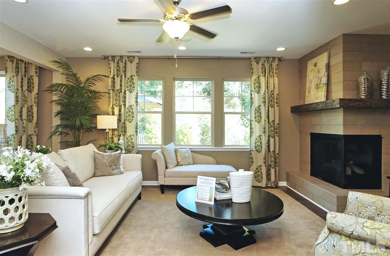 826 Wickham Ridge Road, Unit 6 Apex, NC 27539 - Photo 12 of 25 a living room with furniture and a fireplace