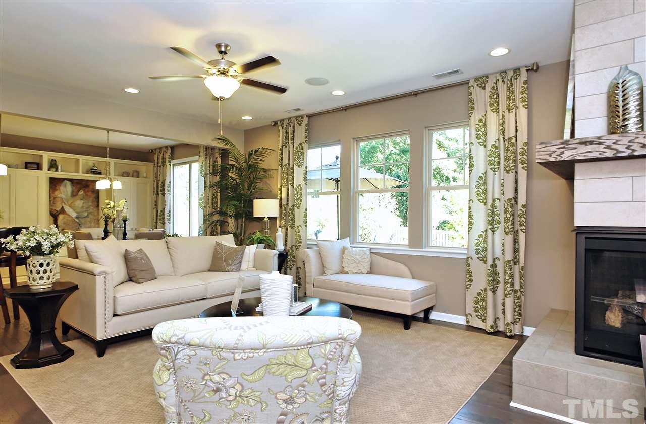 826 Wickham Ridge Road, Unit 6 Apex, NC 27539 - Photo 13 of 25 a living room with furniture and a fireplace