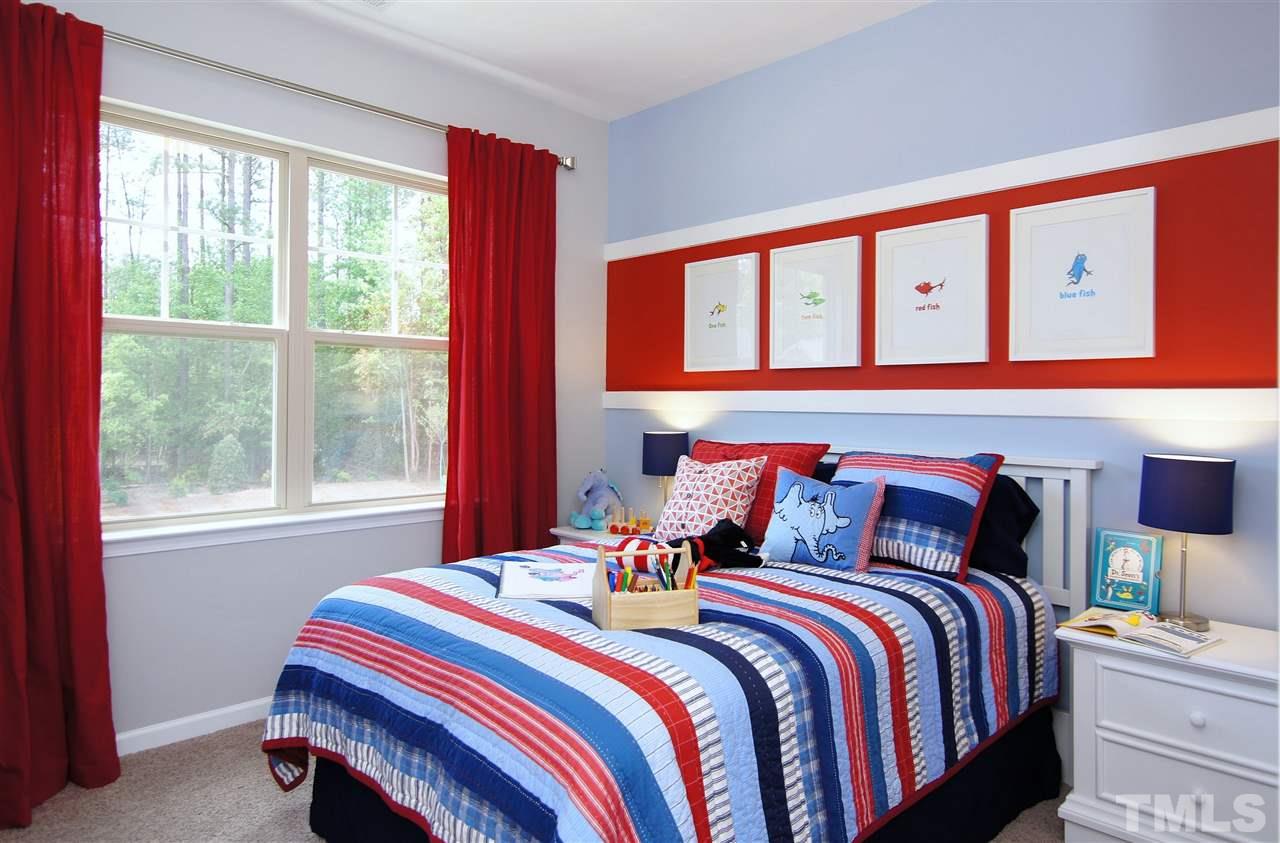826 Wickham Ridge Road, Unit 6 Apex, NC 27539 - Photo 20 of 25 a bedroom with a bed and a window
