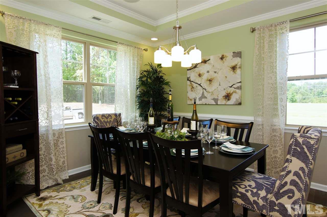 826 Wickham Ridge Road, Unit 6 Apex, NC 27539 - Photo 4 of 25 a view of a dining room with furniture window and outside view