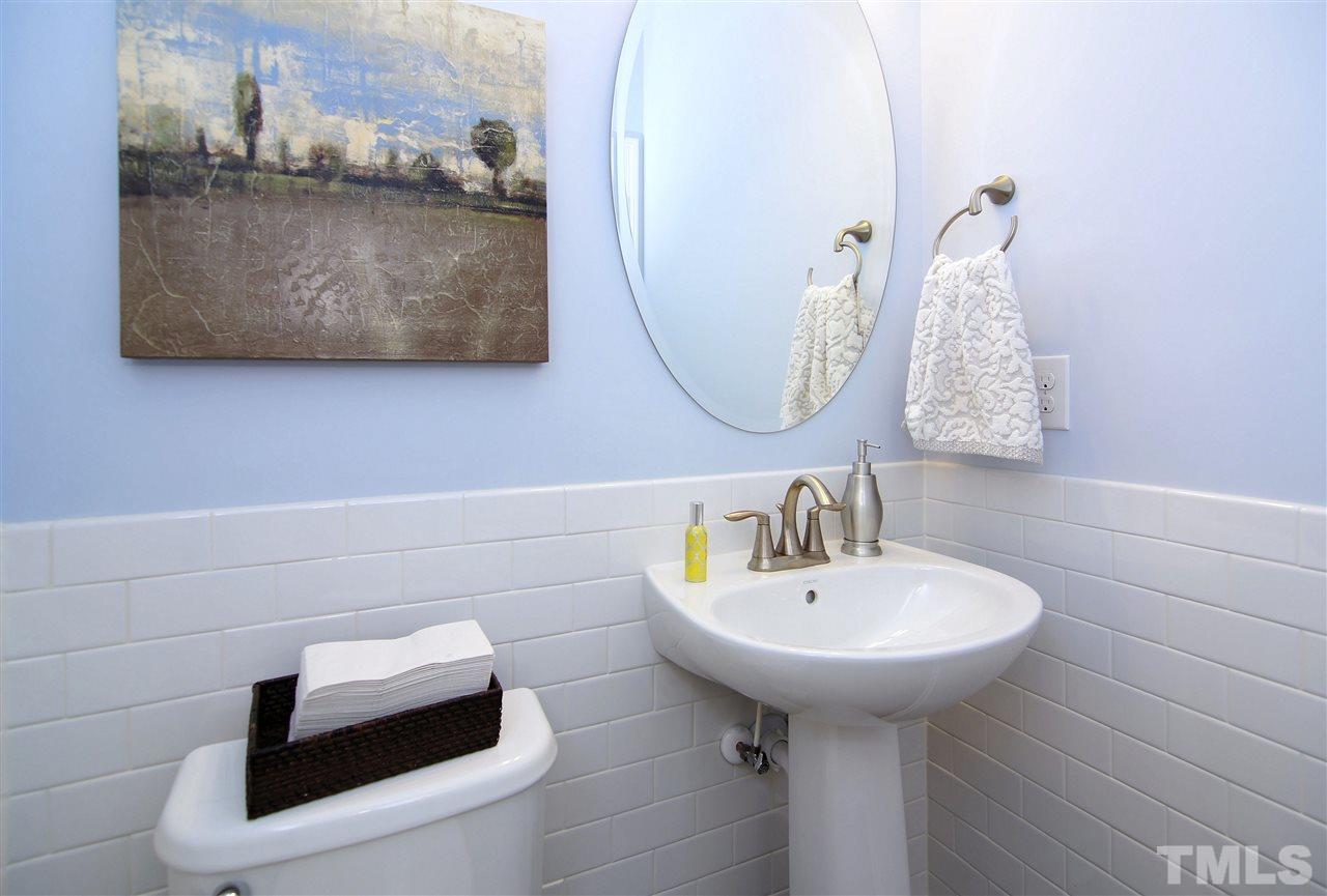 826 Wickham Ridge Road, Unit 6 Apex, NC 27539 - Photo 5 of 25 a bathroom with a sink and mirror