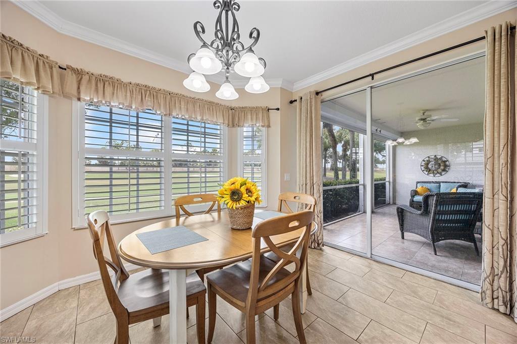 7000 Pinnacle Lane, Unit 1401 Naples, FL 34110 - Photo 12 of 49 a view of a dining room with furniture window and outside view
