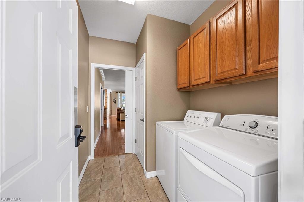 7000 Pinnacle Lane, Unit 1401 Naples, FL 34110 - Photo 18 of 49 a view of storage and utility room with washer and dryer