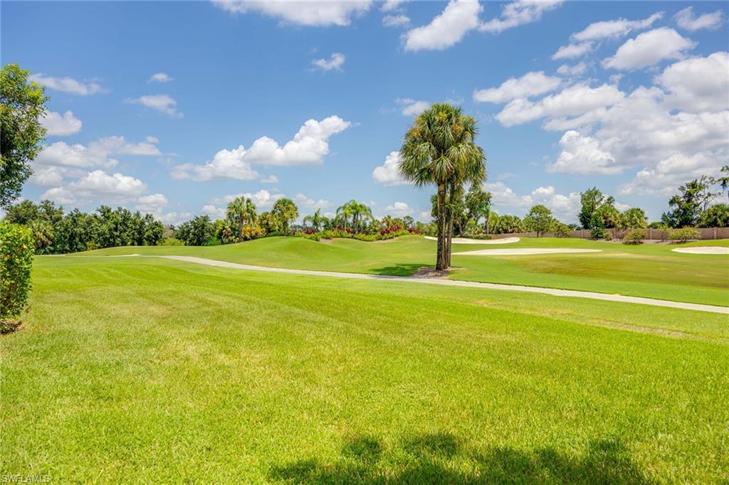 7000 Pinnacle Lane, Unit 1401 Naples, FL 34110 - Photo 22 of 49 a view of a big yard with an empty space and outdoor space