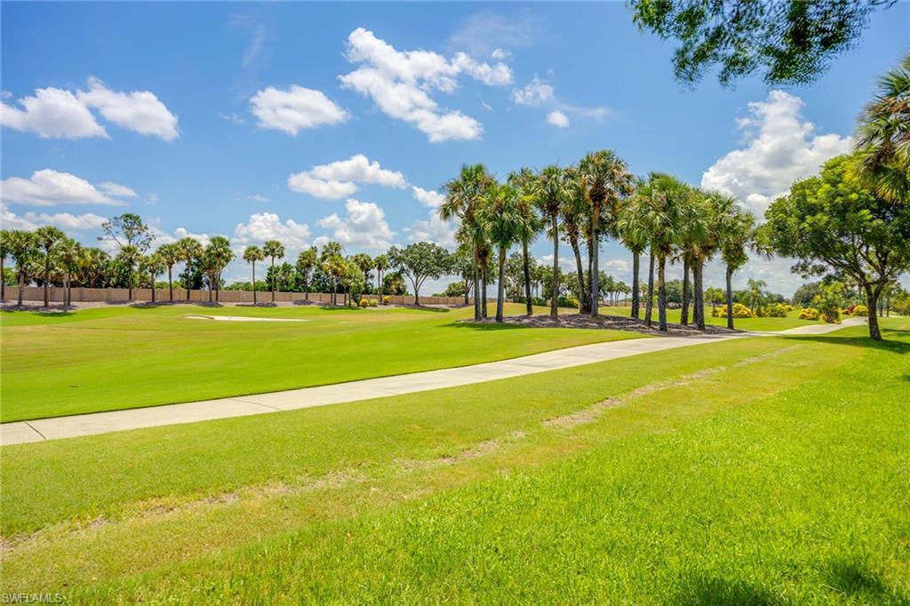 7000 Pinnacle Lane, Unit 1401 Naples, FL 34110 - Photo 23 of 49 a view of a playground with basketball court