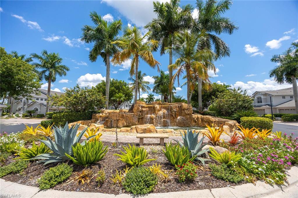 7000 Pinnacle Lane, Unit 1401 Naples, FL 34110 - Photo 28 of 49 a view of a swimming pool with a patio