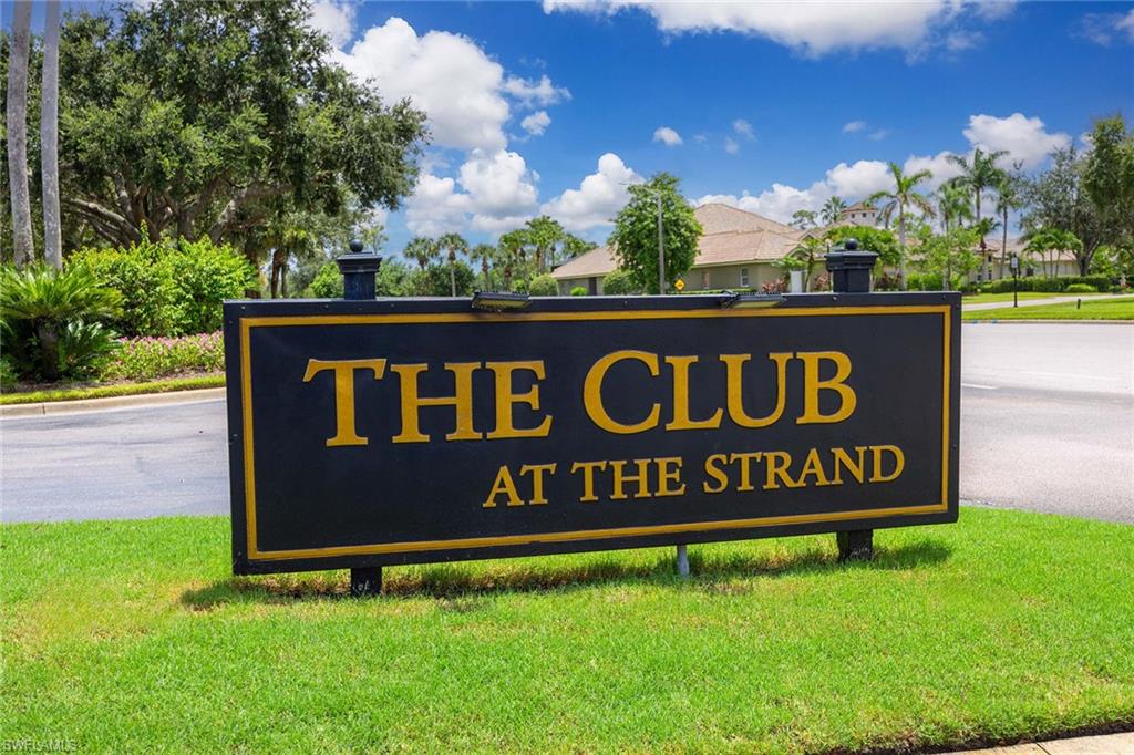 7000 Pinnacle Lane, Unit 1401 Naples, FL 34110 - Photo 29 of 49 a sign on the side of the road