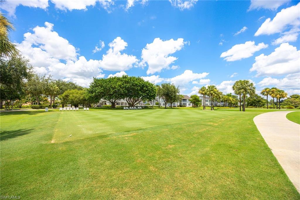 7000 Pinnacle Lane, Unit 1401 Naples, FL 34110 - Photo 31 of 49 a view of a house with a big yard