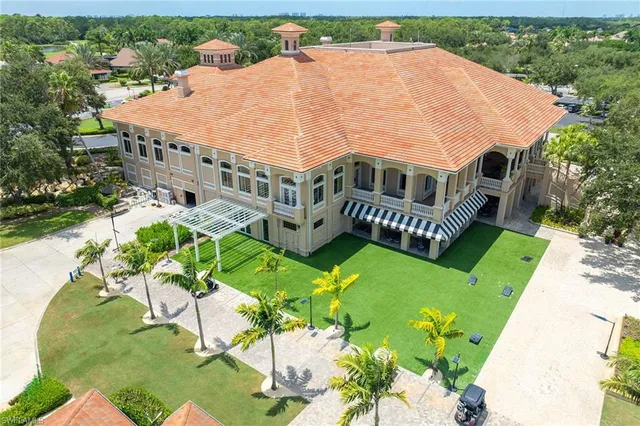 an aerial view of a house with a lake view