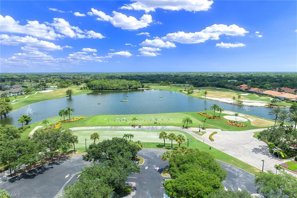 7000 Pinnacle Lane, Unit 1401 Naples, FL 34110 - Photo 47 of 49 a view of a lake with a yard