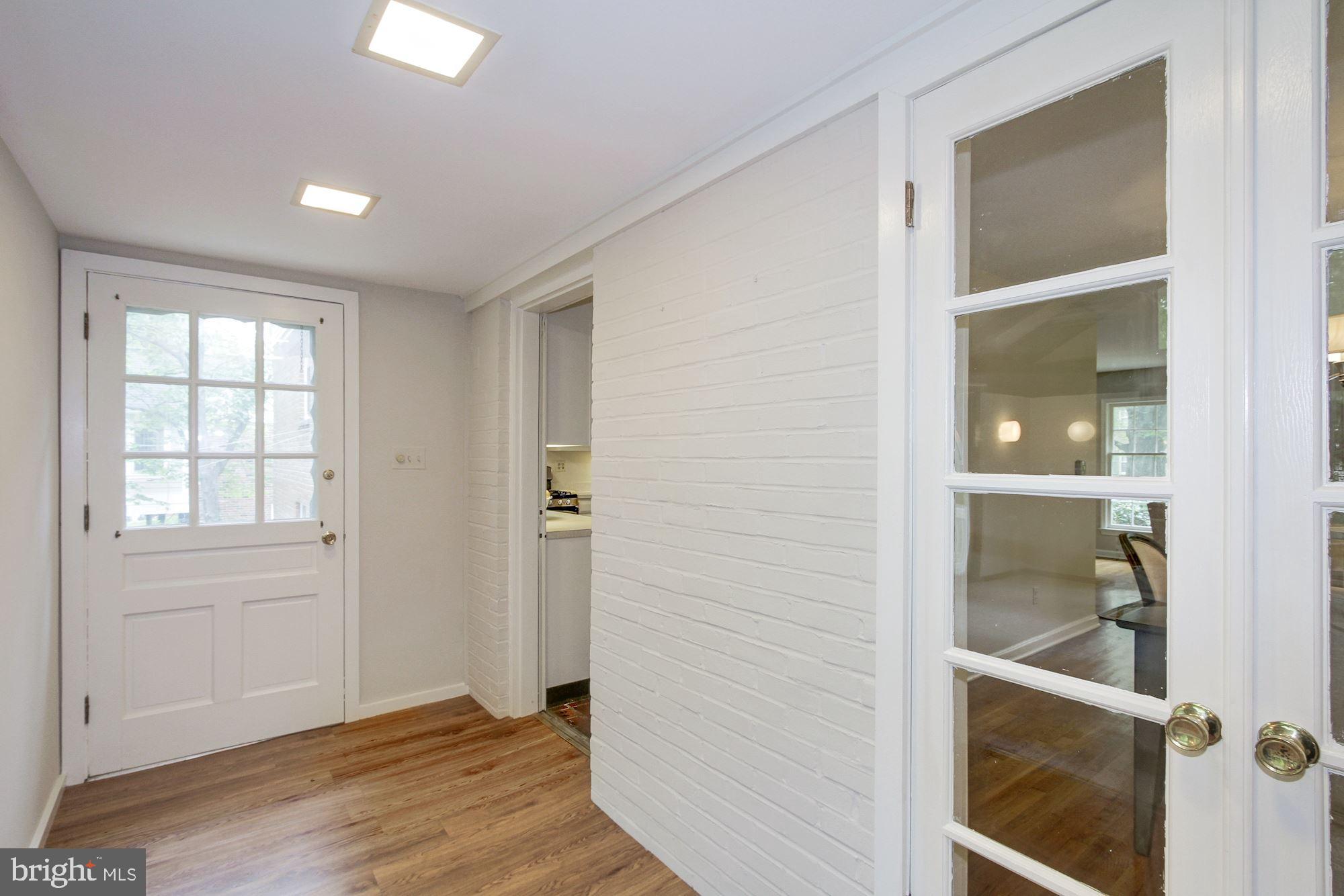 9721 Byeforde Road Kensington, MD 20895 - Photo 12 of 32 Rear Hall with Door to Deck