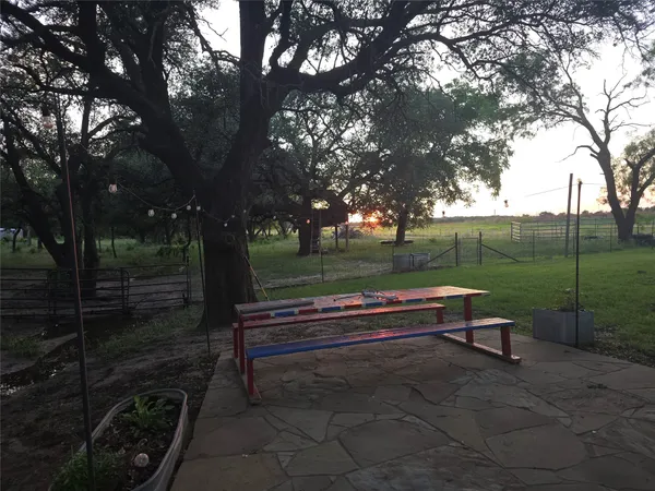 a view of park with bench sitting area