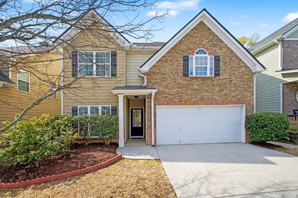 2153 Splitrail Trail Northeast Buford, GA 30519 - Photo 1 of 1 front view of a house with a yard