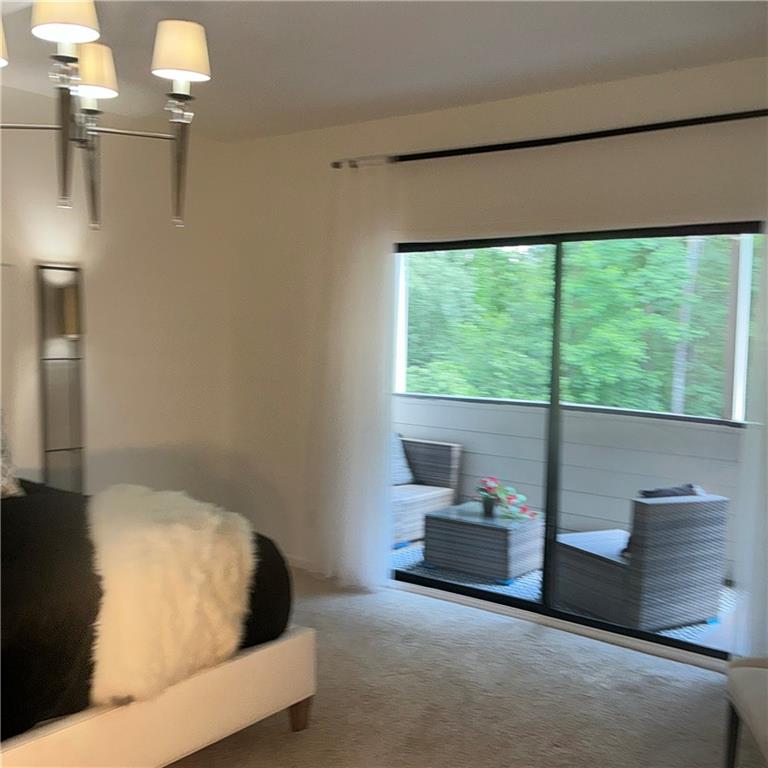3823 Paces Ferry West Atlanta, GA 30339 - Photo 20 of 33 a bedroom with a bed and a large window