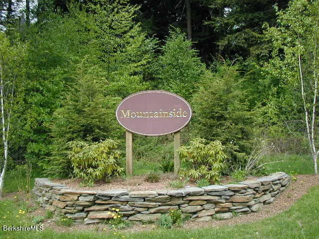 a view of a backyard with a barn