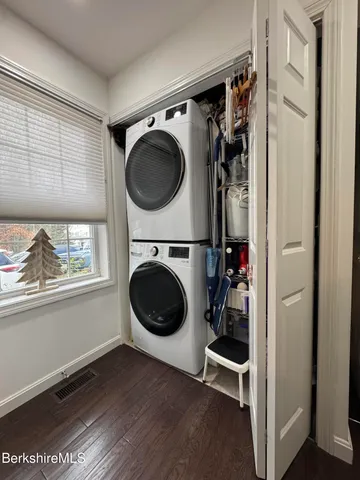 a view of a hallway with washer and dryer