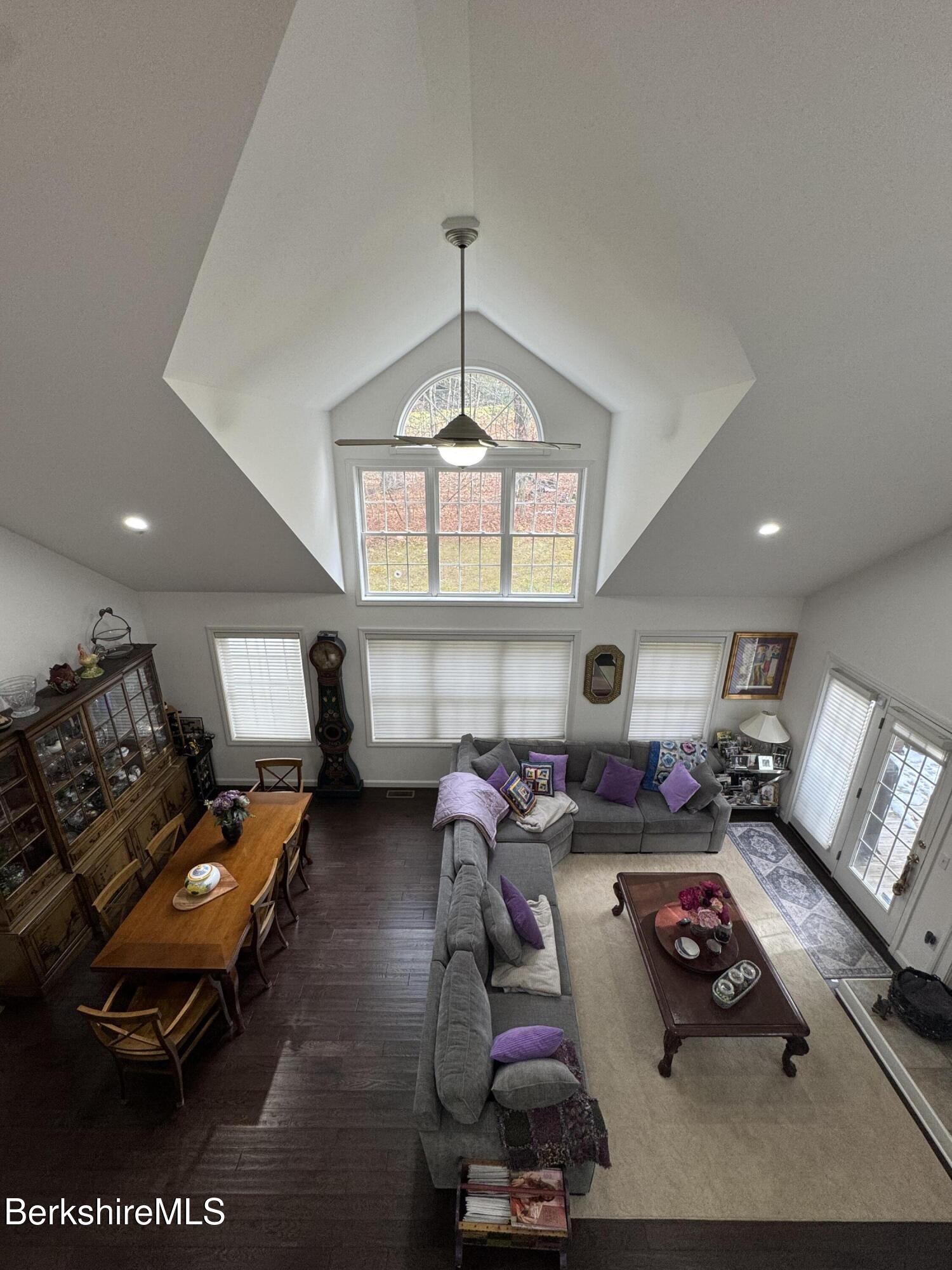 9102 Mountainside Drive Hancock, MA 01237 - Photo 19 of 31 a living room with furniture and a chandelier
