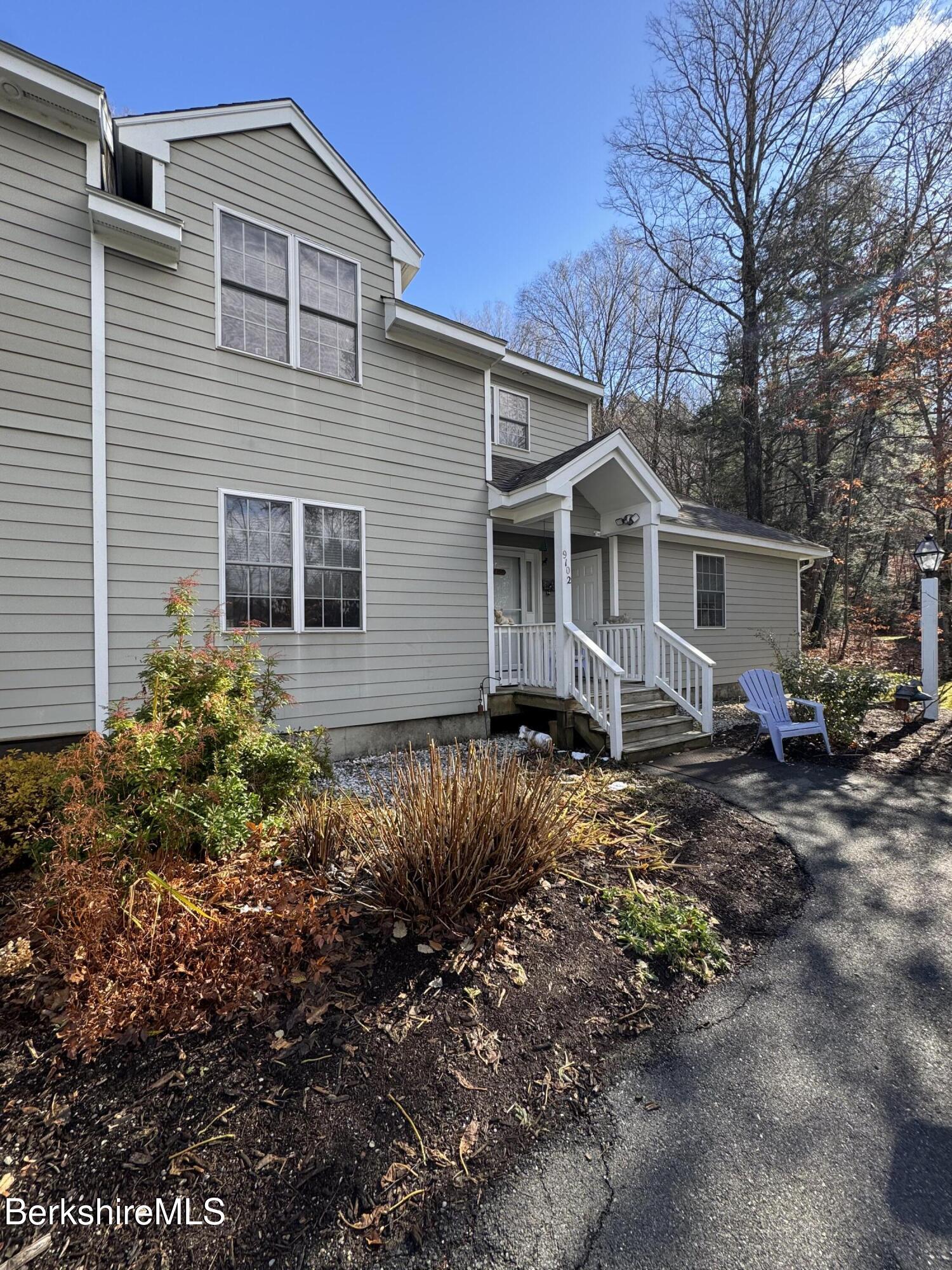9102 Mountainside Drive Hancock, MA 01237 - Photo 2 of 31 a view of a house with a yard