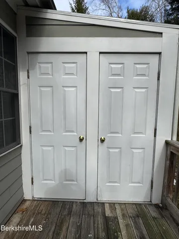 a view of a livingroom with wooden floor