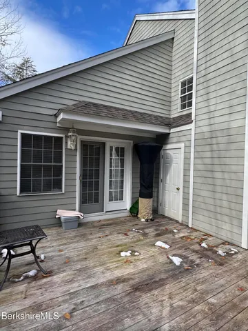 a front view of a house with large windows