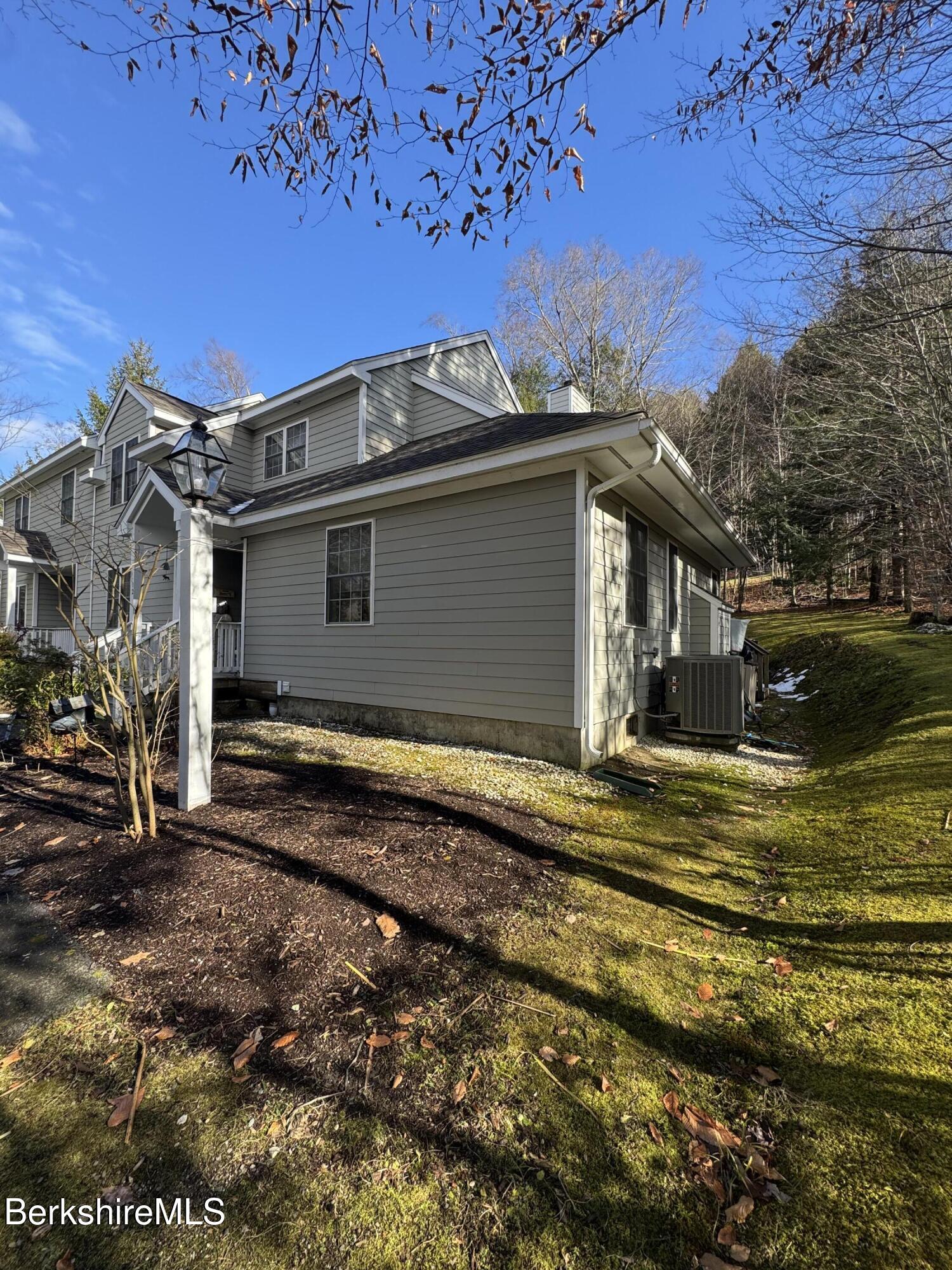 9102 Mountainside Drive Hancock, MA 01237 - Photo 31 of 31 a view of a house with a backyard
