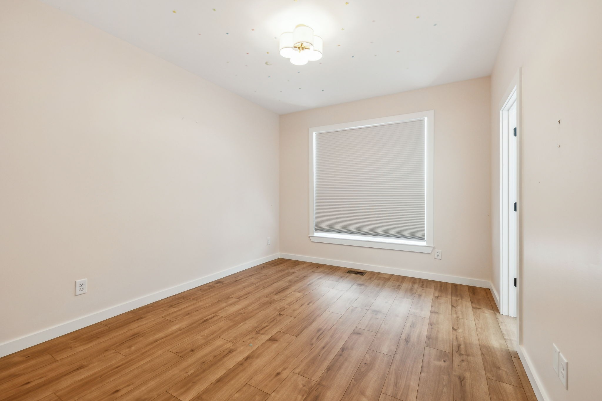 268 Dink Rut Road Portland, TN 37148 - Photo 27 of 40 a view of an empty room with wooden floor and a window