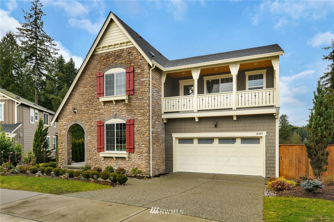 15927 98th Avenue Northeast Bothell, WA 98011 - Photo 2 of 33 a front view of a house with garden