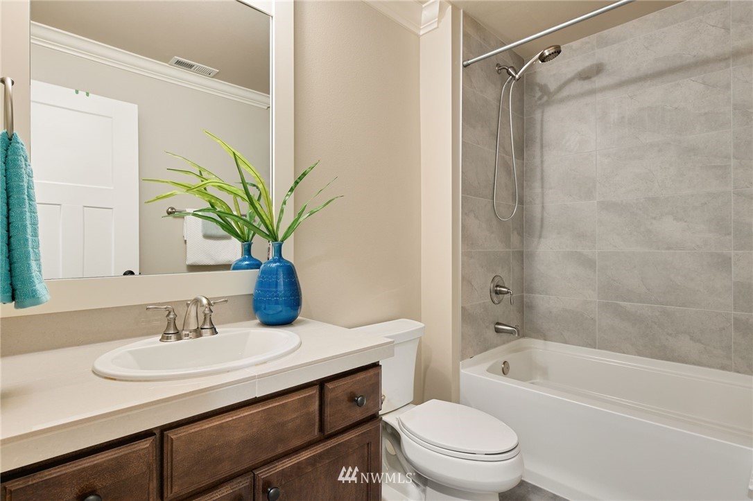 15927 98th Avenue Northeast Bothell, WA 98011 - Photo 14 of 33 a bathroom with a granite countertop sink a toilet and shower