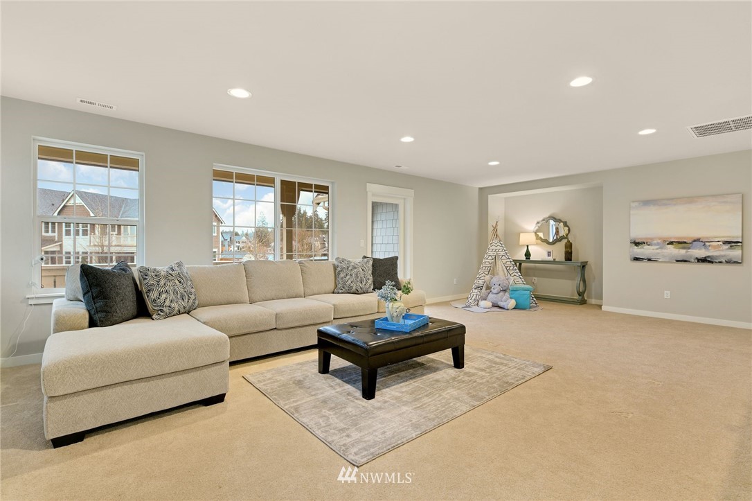 15927 98th Avenue Northeast Bothell, WA 98011 - Photo 15 of 33 a living room with furniture and a potted plant