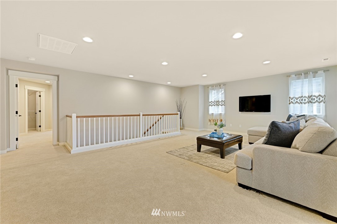 15927 98th Avenue Northeast Bothell, WA 98011 - Photo 16 of 33 a living room with furniture and a flat screen tv