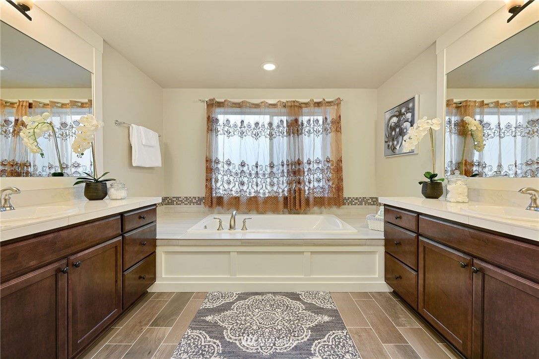 15927 98th Avenue Northeast Bothell, WA 98011 - Photo 20 of 33 a spacious bathroom with a tub sink and mirror