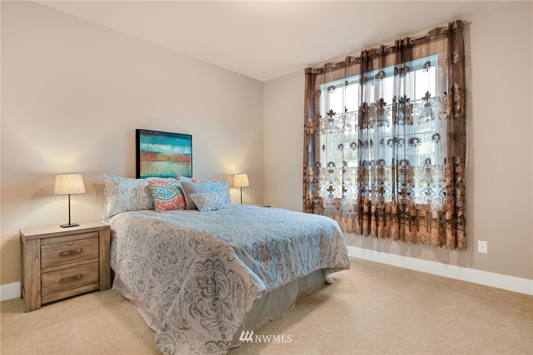 15927 98th Avenue Northeast Bothell, WA 98011 - Photo 23 of 33 a bedroom with a bed and a night stand
