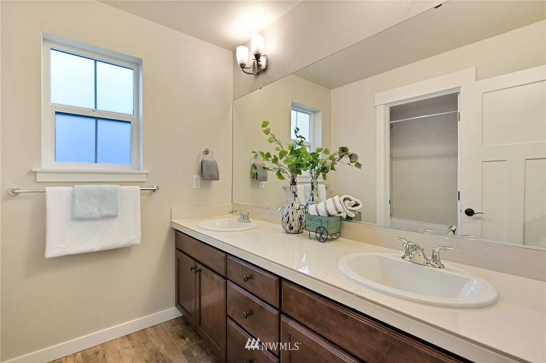 15927 98th Avenue Northeast Bothell, WA 98011 - Photo 24 of 33 a bathroom with a sink and a mirror