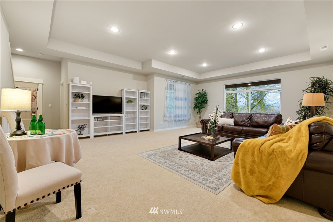 15927 98th Avenue Northeast Bothell, WA 98011 - Photo 26 of 33 a living room with furniture and a flat screen tv