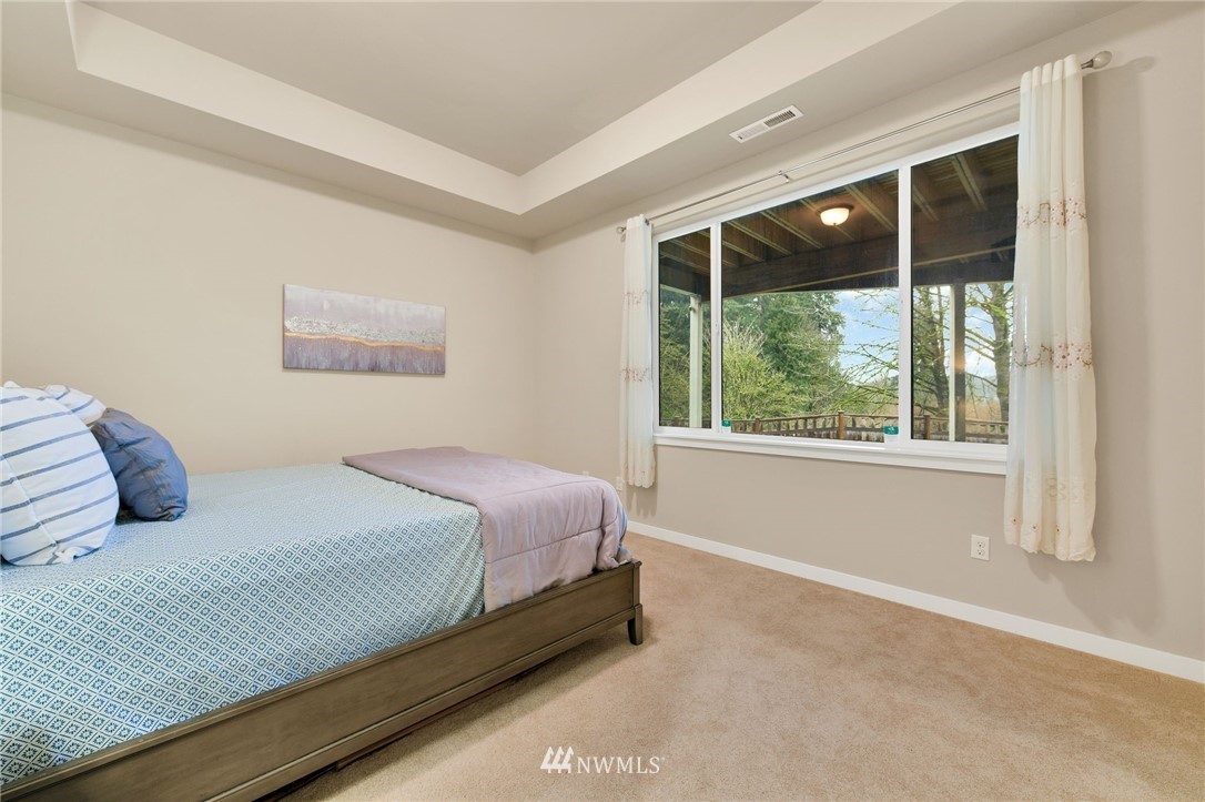 15927 98th Avenue Northeast Bothell, WA 98011 - Photo 28 of 33 a bedroom with a bed and a window