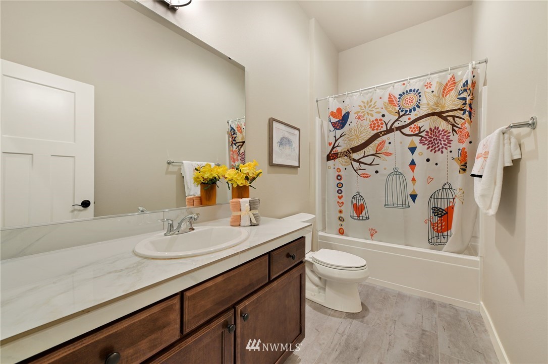 15927 98th Avenue Northeast Bothell, WA 98011 - Photo 29 of 33 a bathroom with a sink vanity mirror and toilet