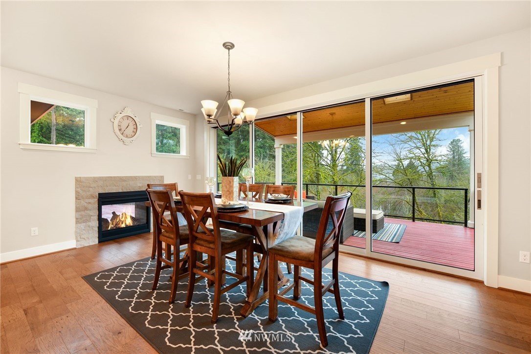 15927 98th Avenue Northeast Bothell, WA 98011 - Photo 6 of 33 a dining room with furniture a chandelier and wooden floor