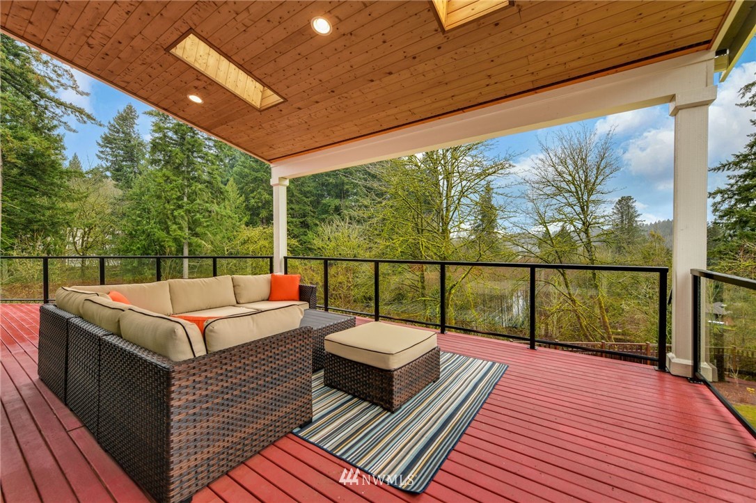 15927 98th Avenue Northeast Bothell, WA 98011 - Photo 8 of 33 a view of a wooden deck with a bench