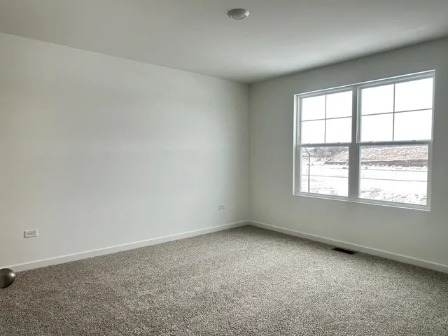 a bathroom with a double vanity sink toilet and a mirror